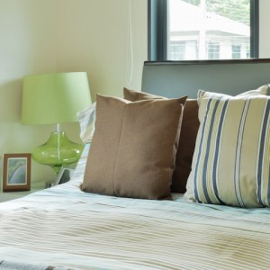 Striped bedding in modern decorated bedroom