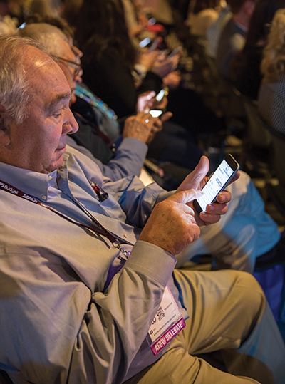 An AFBF attendee voting via cellphone.